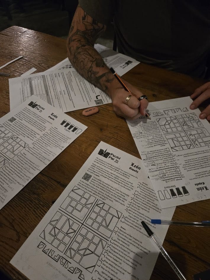 A Puzzled Pint puzzle packet in progress, pencils and all