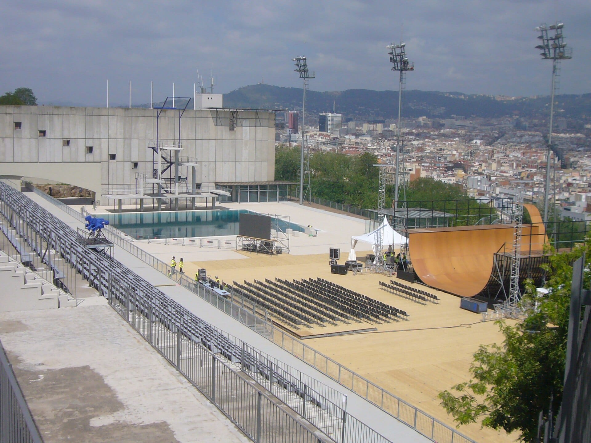 The Piscina Municipal de Montjuic, an outdoor pool in Barcelona with the city skyline behind