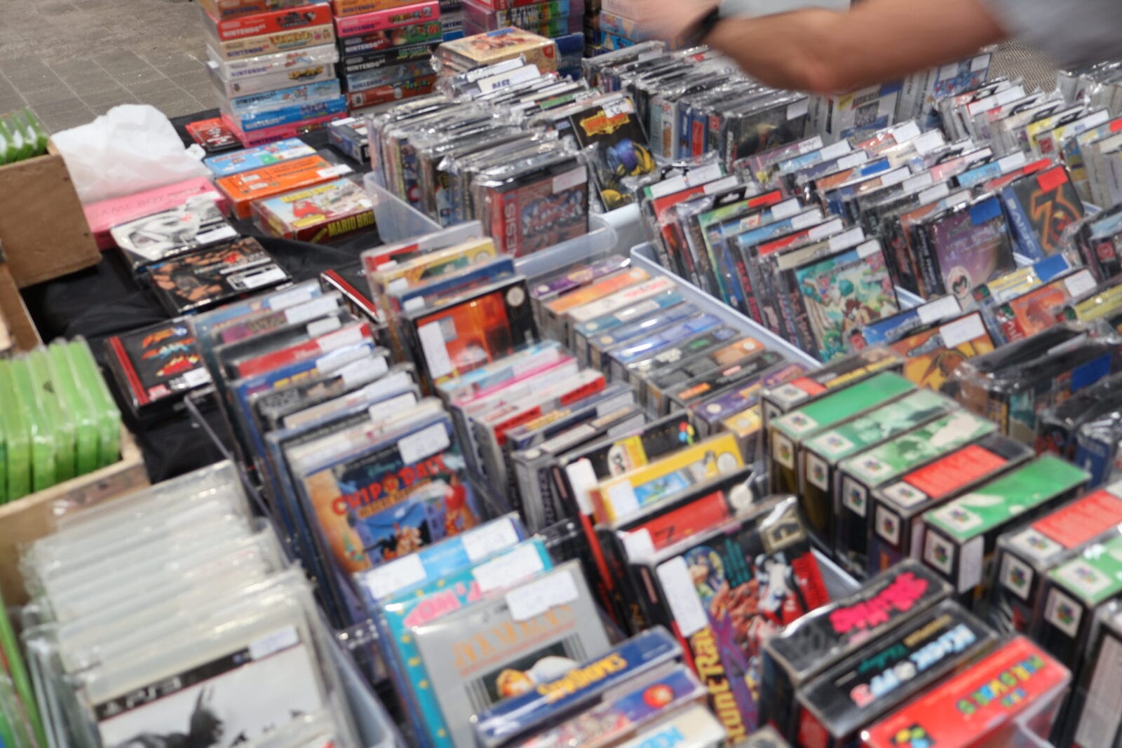 Boxes of vintage games on offer at a trader's stall