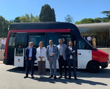 An electric minibus operating in Barcelona city streets as part of TMB's zero-emission transport initiative.