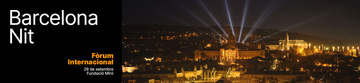 Nighttime atmosphere along Barcelona's waterfront in an archive image, showing city lights reflecting on the sea.