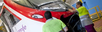 Railway maintenance workshop in Barcelona with high-speed trains undergoing servicing, 20th October 2026