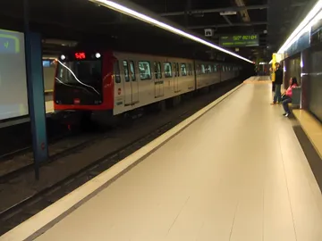 Aerial view of Barcelona metro line L5 running beneath tree-lined streets near Sagrada Família.