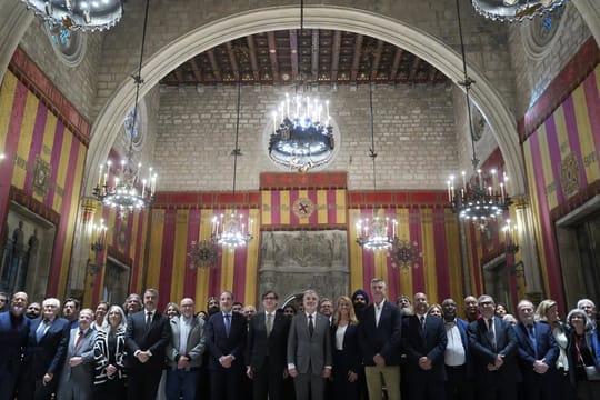 Barcelona Mayor Jaume Collboni speaking at a podium with other officials present during Interconfessional Harmony Week.