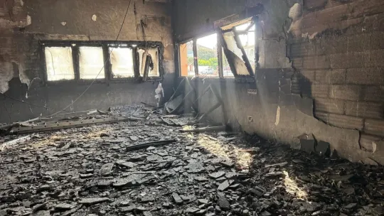Police tape and fire damage at the entrance of a mosque in Piera, Barcelona province.