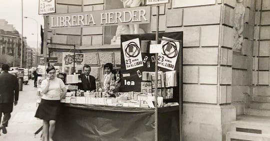 Exterior view of Alibri bookshop on Carrer Balmes in Barcelona, showing its large display windows and entrance.
