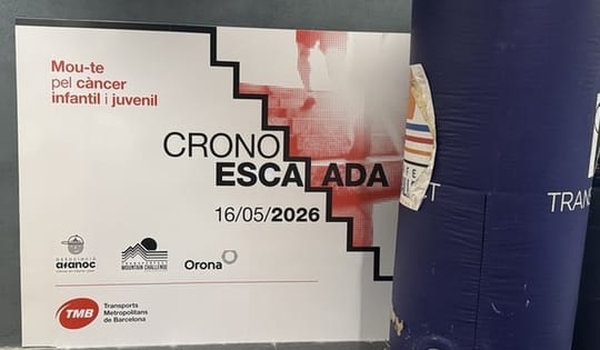 Athletes climbing stairs inside Barcelona's El Coll/La Teixonera metro station during a charity event.