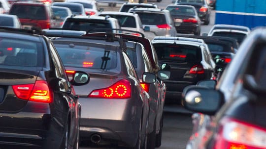 Heavy traffic on a multi-lane motorway approaching Barcelona during a holiday return operation