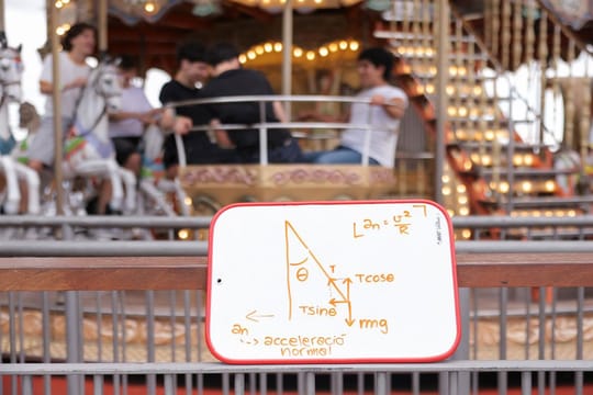 Students conducting physics experiments on an amusement park ride at Tibidabo, Barcelona.