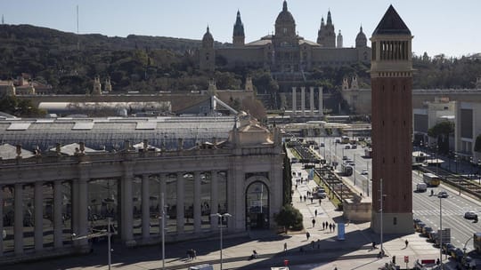 Exterior view of the Palacio de Comunicaciones y Transportes at Fira de Montjuïc, Barcelona, with its grand architectural fea