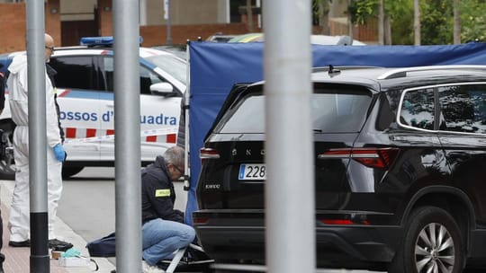 Catalan police officers, Mossos d'Esquadra, patrol a street in Barcelona.