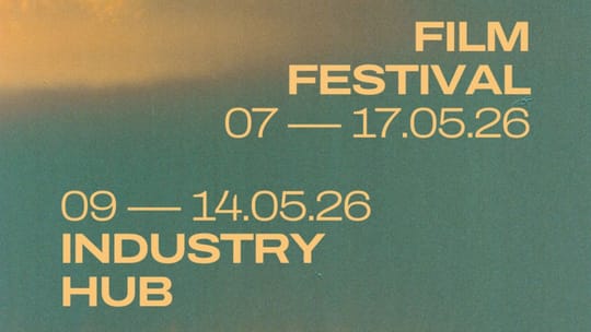 A vibrant film festival poster for DocsBarcelona 2026 with abstract shapes and film reel elements, set against a Barcelona ci