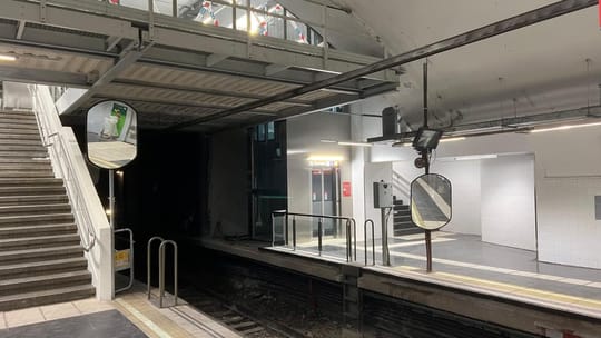 Modernised entrance to El Clot metro station with new lifts and signage, showing improved accessibility features.