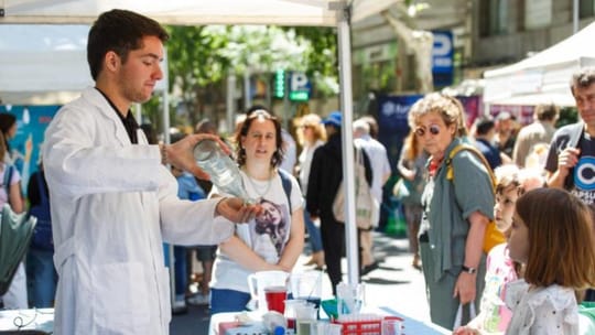 People participating in outdoor health activities on a street in Barcelona