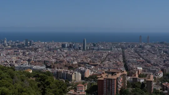 A quiet, tree-lined street with large, elegant residential buildings in Barcelona's Les Tres Torres neighbourhood.