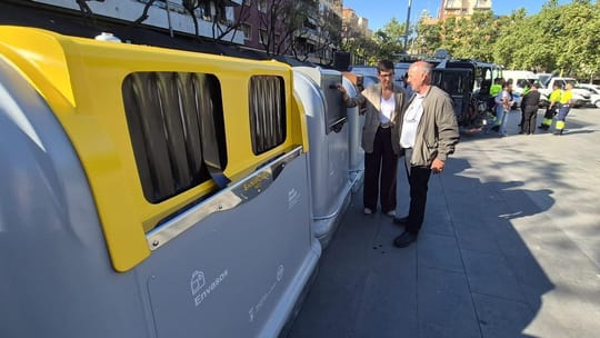New metallic, fire-resistant waste containers being installed on a street in Sant Adrià de Besòs, with a modern waste collect