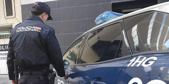 Police officers inspecting shelves of a supermarket, with some bottles of health supplements visible.