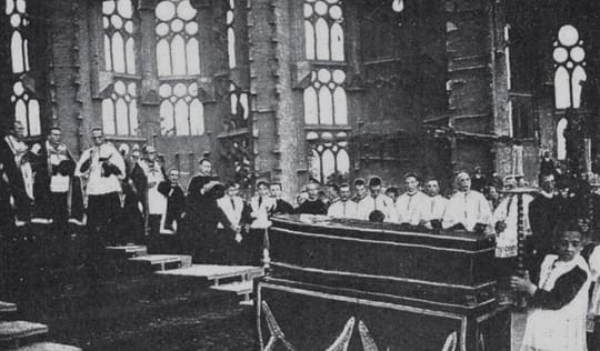 Antoni Gaudí's funeral procession in Barcelona, 1926, with a large crowd gathered.