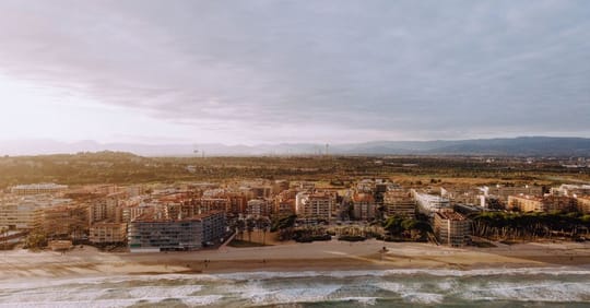 Badalona beach at night during Sant Joan festival with bonfires and people celebrating