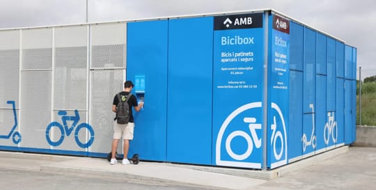 A modern Bicibox parking facility with multiple bicycle and scooter spaces inside a secure, enclosed structure.