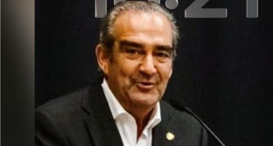 Benito Miró, El Salvador's Consul General in Barcelona, in a formal setting.