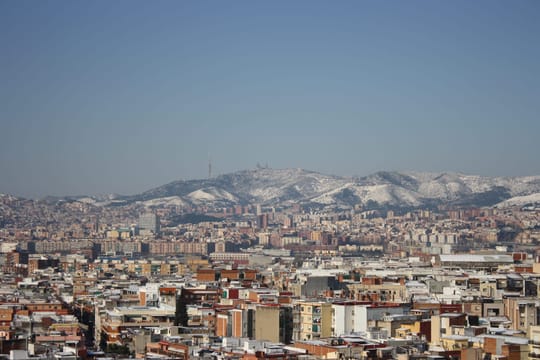 Snow-dusted rooftops and the Collserola hills after a rare snowfall in Barcelona