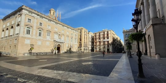 Plaça Sant Jaume in central Barcelona ahead of a planned far-right demonstration, with City Council and Generalitat buildings visible.
