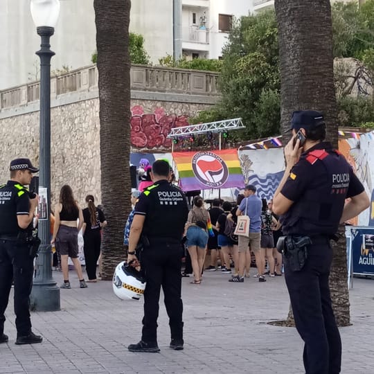 Mossos d'Esquadra patrol cars outside the police complex on Placa d'Espanya, Barcelona