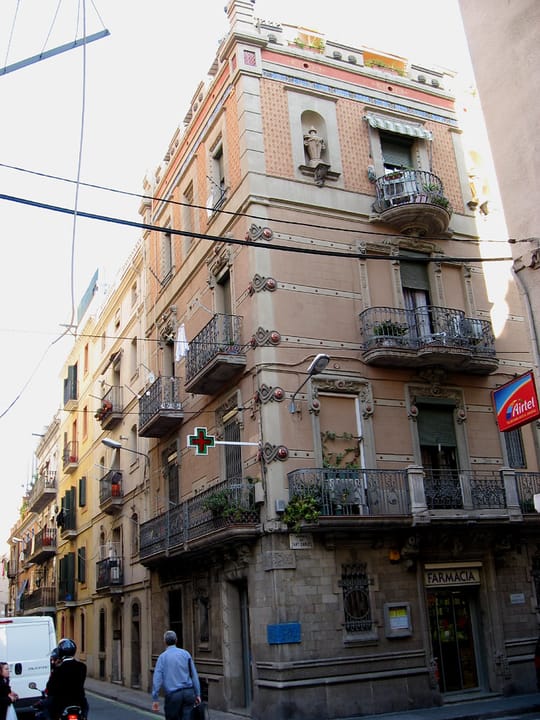 Aerial view of La Barceloneta in Barcelona showing narrow streets and dense urban layout near the seafront.