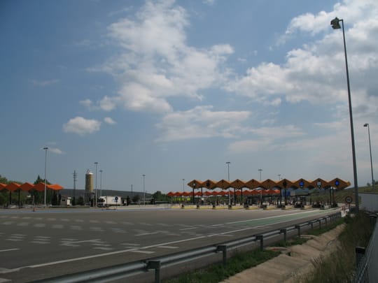 Aerial view of heavy traffic congestion on the AP-7 motorway near Barcelona, with vehicles moving slowly under overcast skies.