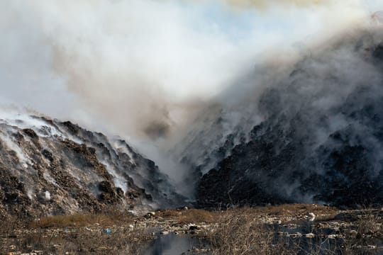 Firefighters attend a waste fire at the Can Mata landfill in Els Hostalets de Pierola, Barcelona province.