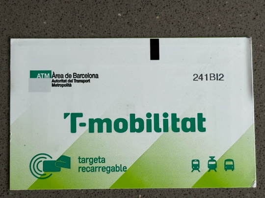 A photo montage shows three T-Mobilitat travel-card supports used on Barcelona’s metro network.