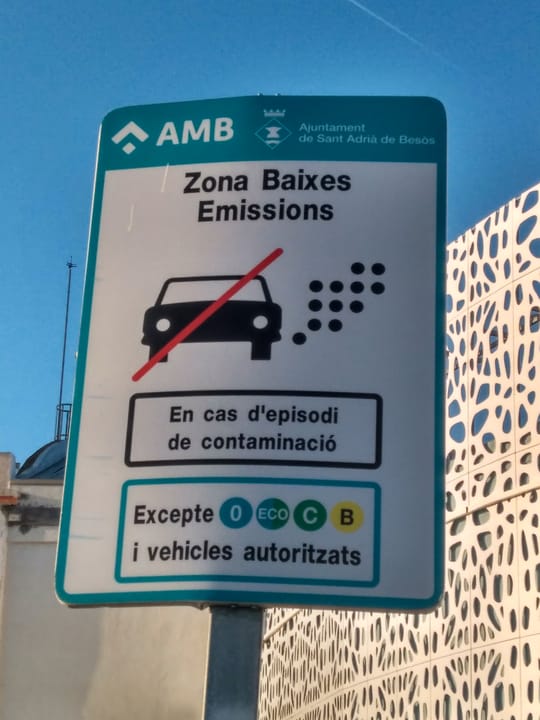 Parking area at the edge of Rubí's Low Emission Zone, showing vehicles parked outside the restricted perimeter.