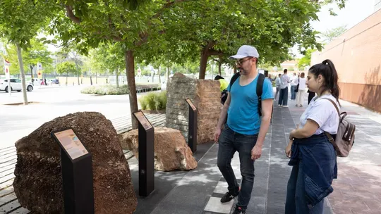 Visitors explore the Universitat de Barcelona's new open-air Geological Garden in Les Corts, featuring rock displays and educ