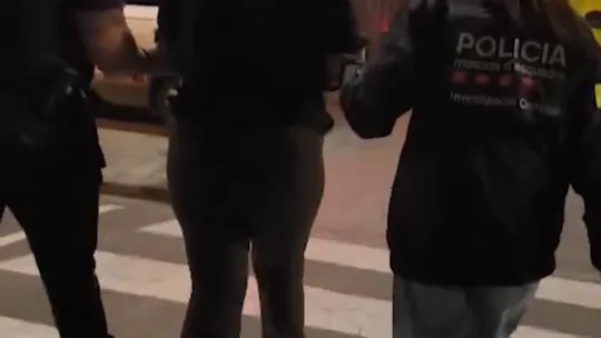 Police car with flashing lights in a Barcelona street at night