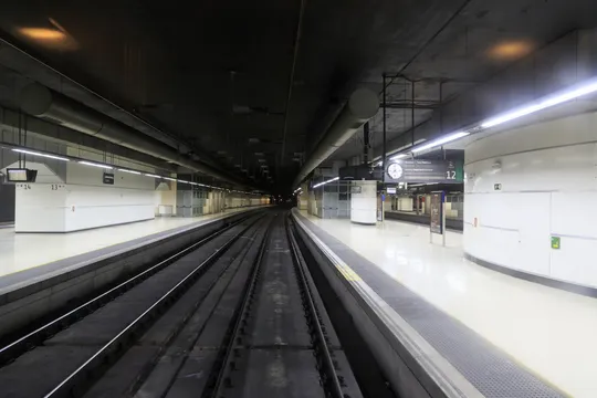 A view of the railway tunnels leading into Barcelona Sants station, showing overhead electrical systems and tracks.