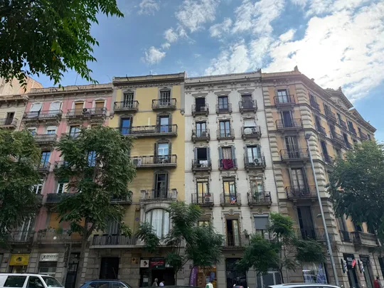 Image showing a view of Barcelona's metropolitan housing landscape with mixed residential buildings and urban density.