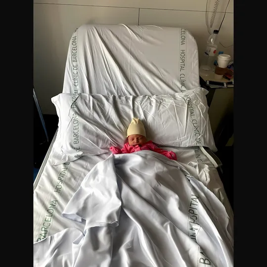 A child's hand drawing with a crayon, symbolising mental health recovery and education at Clínic Hospital's Day Hospital in Barcelona.