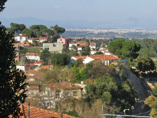 An industrial building on Passatge de la Salut in La Floresta, Sant Cugat del Vallès, surrounded by residential streets.