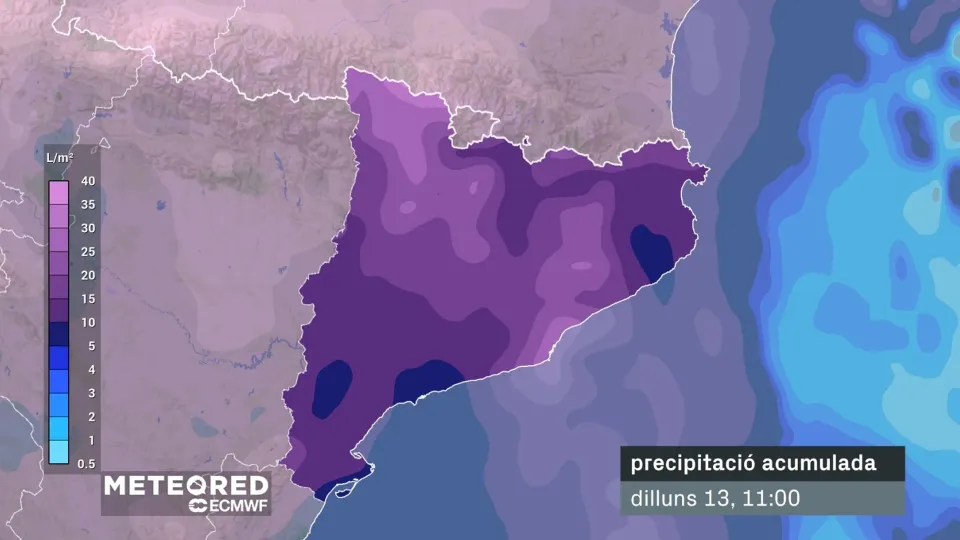 Dark, cloudy sky over Barcelona with rain falling, showing a contrast to previous sunny days.