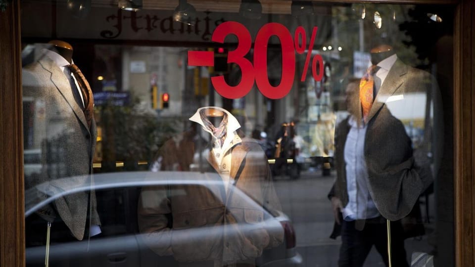 Exterior view of a traditional tailor shop on Rambla Catalunya in Barcelona, with its classic signage and display window.