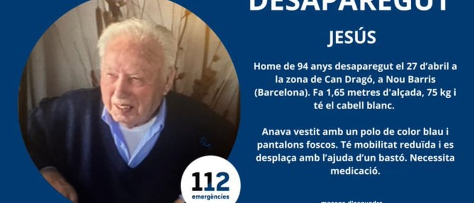 A photograph of Jesús, a 94-year-old man with white hair, wearing a blue polo shirt and dark trousers, looking directly at th
