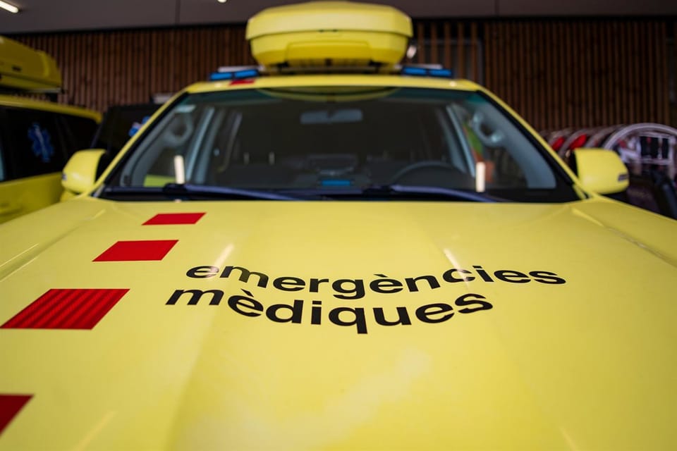 Emergency services vehicles, including police and ambulance, at the scene of an industrial accident.