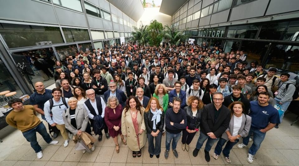 Students collaborate on laptops at the Digital Talent Hub during Barcelona's first inter-university climate hackathon.