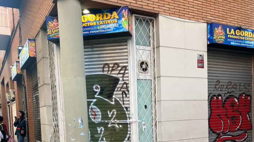 Police tape and officers investigating a crime scene on a street in Barcelona's Sants-Montjuïc district.