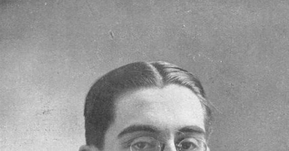 A book cover for 'Teatre inèdit de l'exili' with a vintage photo of Ambrosi Carrion, a Catalan playwright, on display.