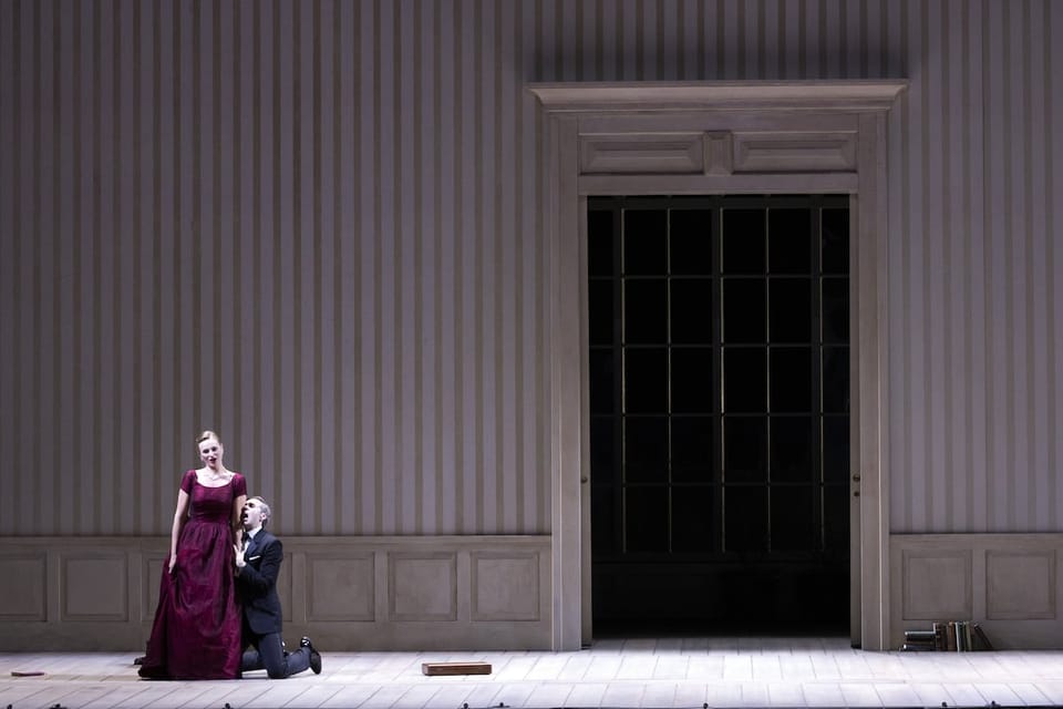 A dramatic stage scene from the opera Werther at the Gran Teatre del Liceu, showing tenor Xabier Anduaga as Werther and mezzo