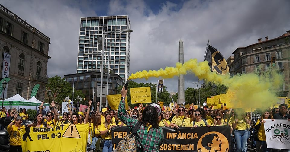 Undercover police officers attending a teachers' assembly in Barcelona, observed by union members.