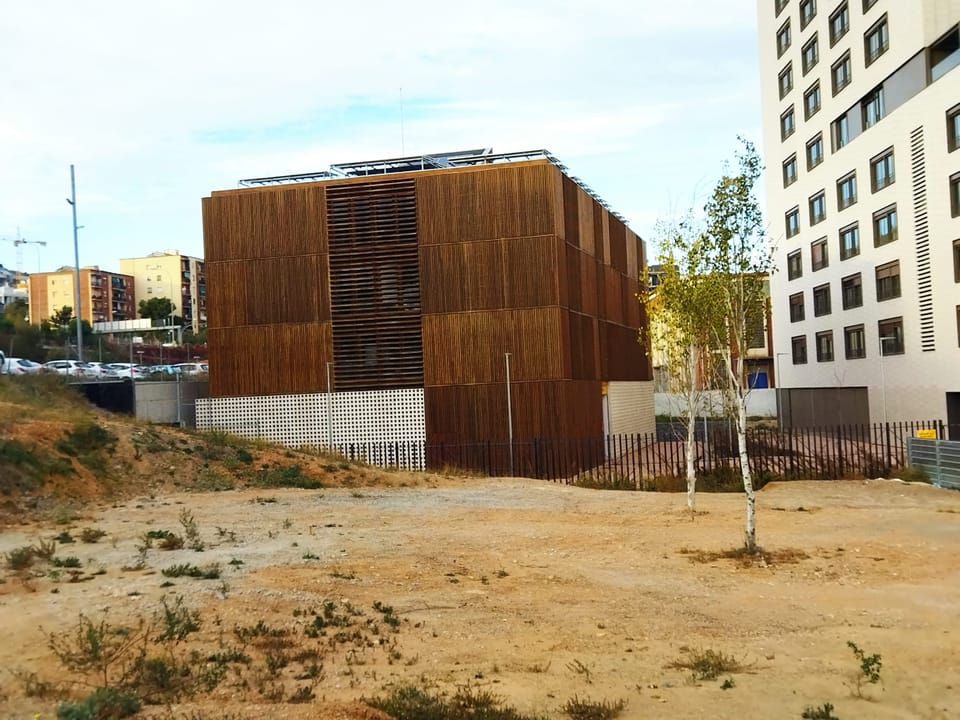Exterior view of the modern Community Life Centre building in Barcelona's Trinitat Vella neighbourhood.