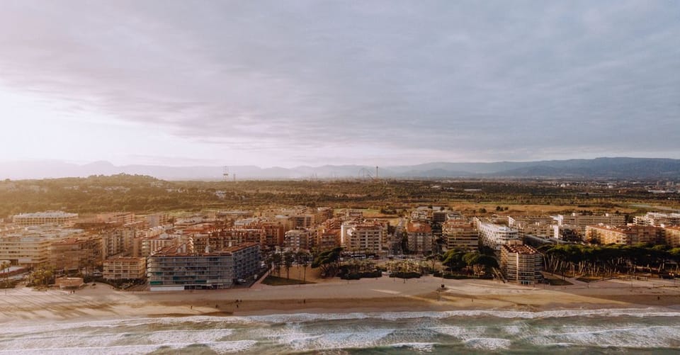 Badalona beach at night during Sant Joan festival with bonfires and people celebrating